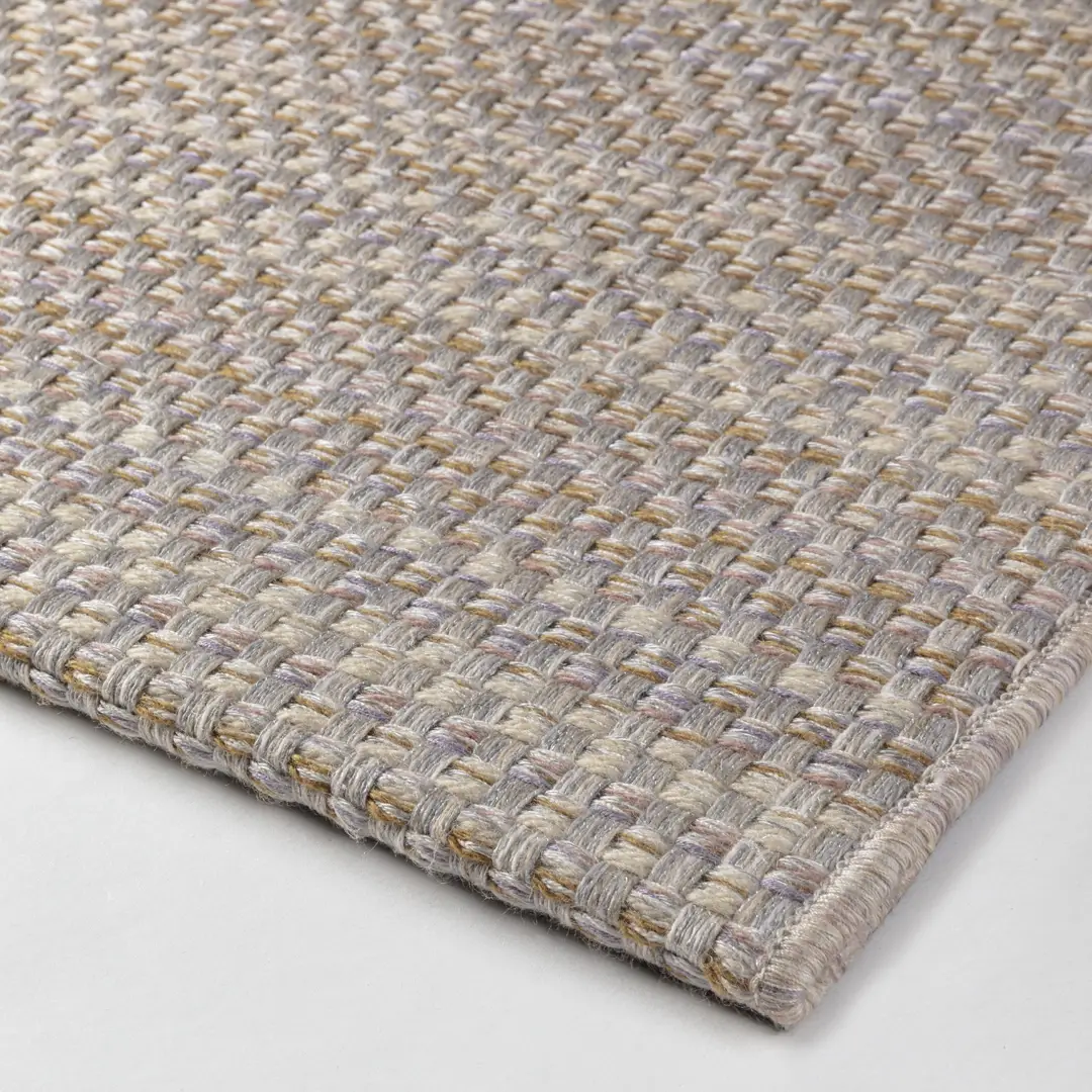 Close-up texture of woven beige area rug