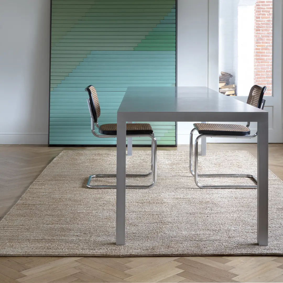 Modern table with chairs in contemporary room setting