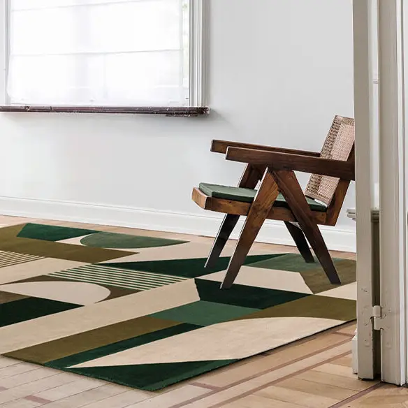 Modern wooden chair on geometric patterned rug in room