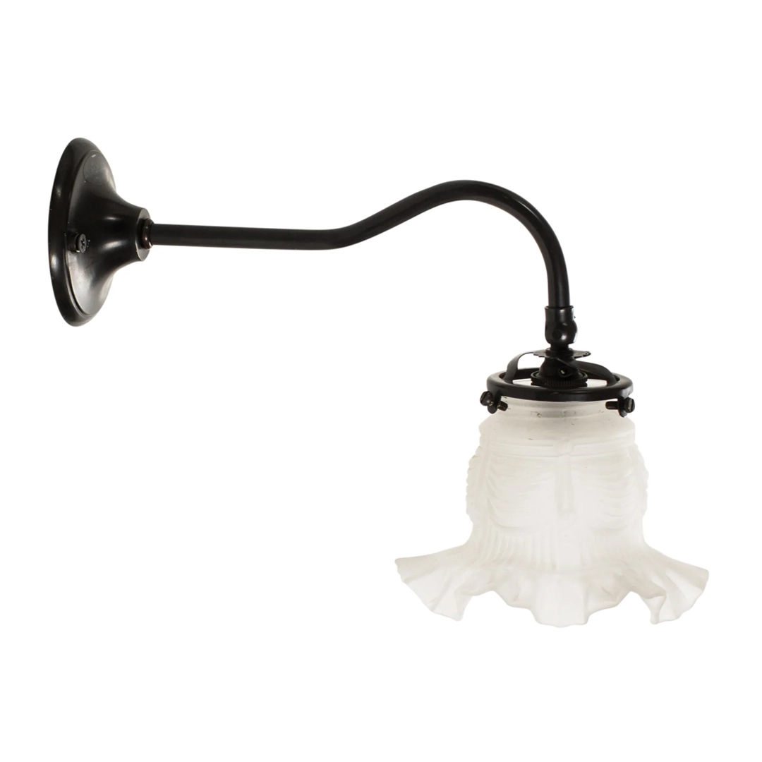 Vintage wall-mounted sconce with frosted glass shade