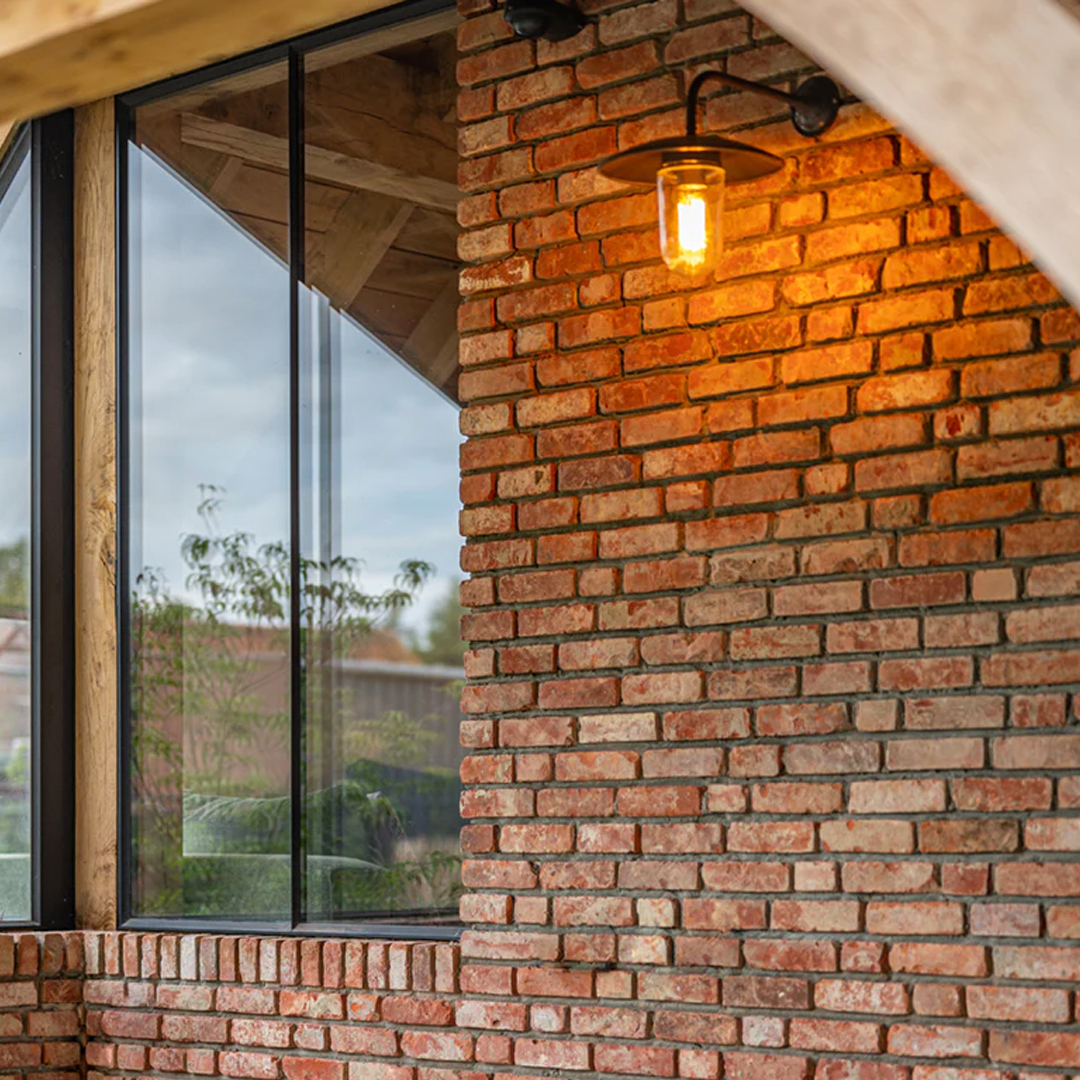 Brick wall with window and hanging light fixture