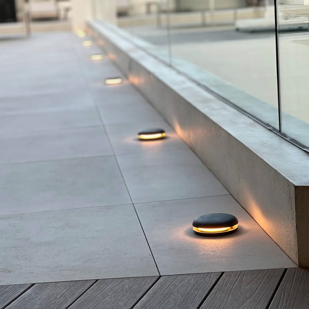 Outdoor lights embedded in modern patio floor