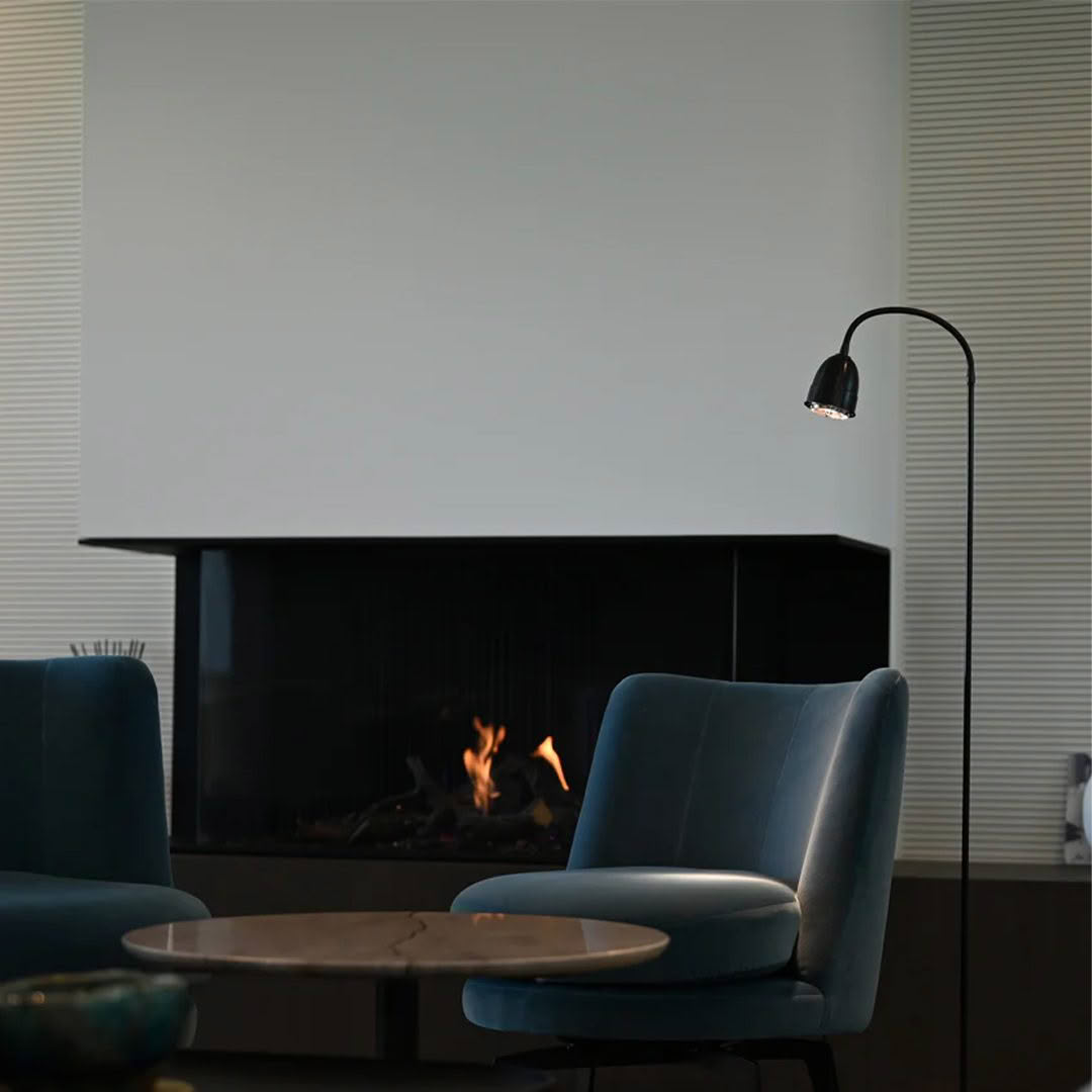 Modern living room with fireplace and stylish floor lamp