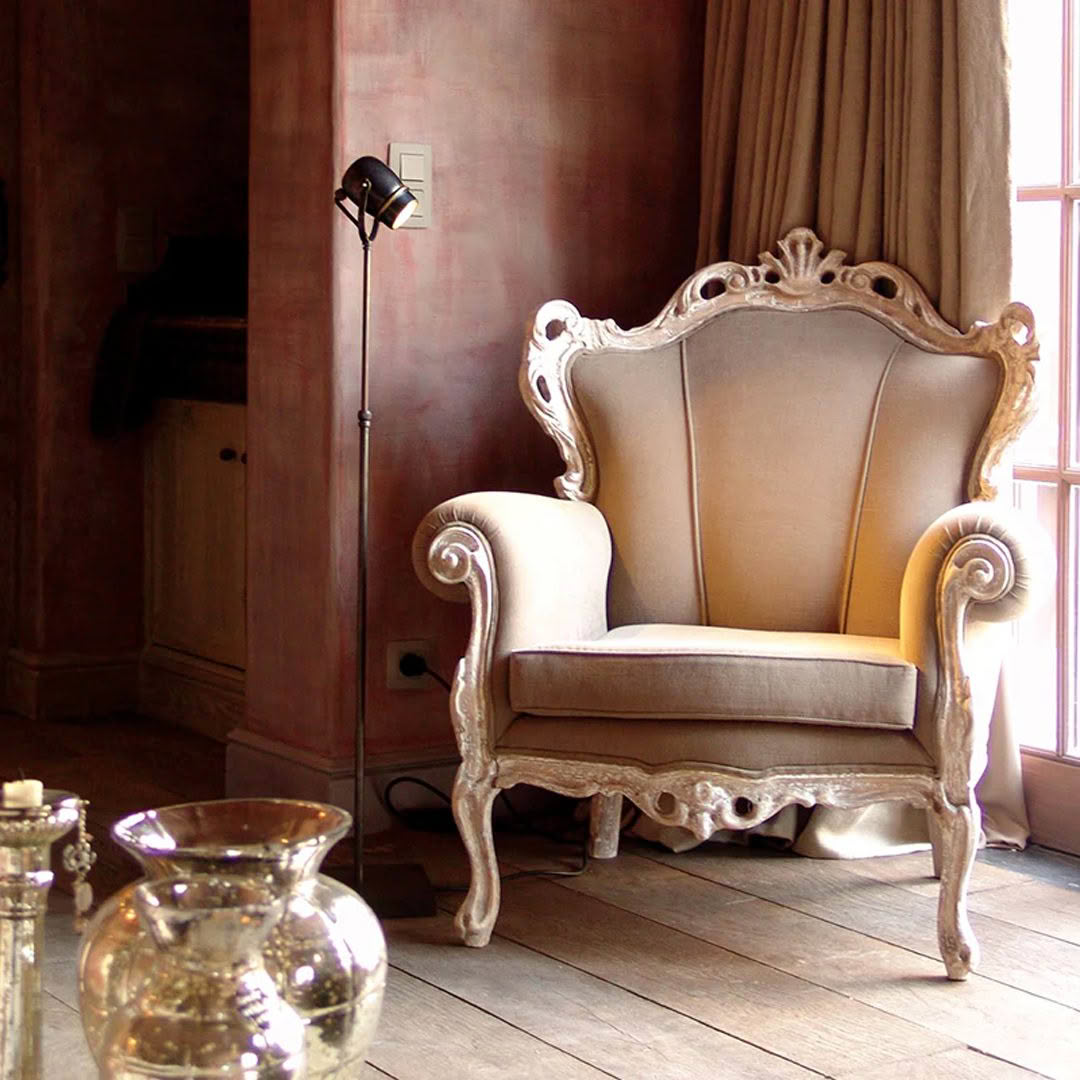 Elegant vintage chair in richly decorated room