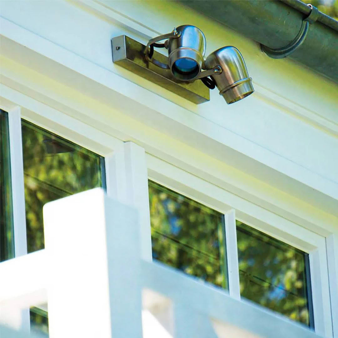 Security camera mounted on house exterior