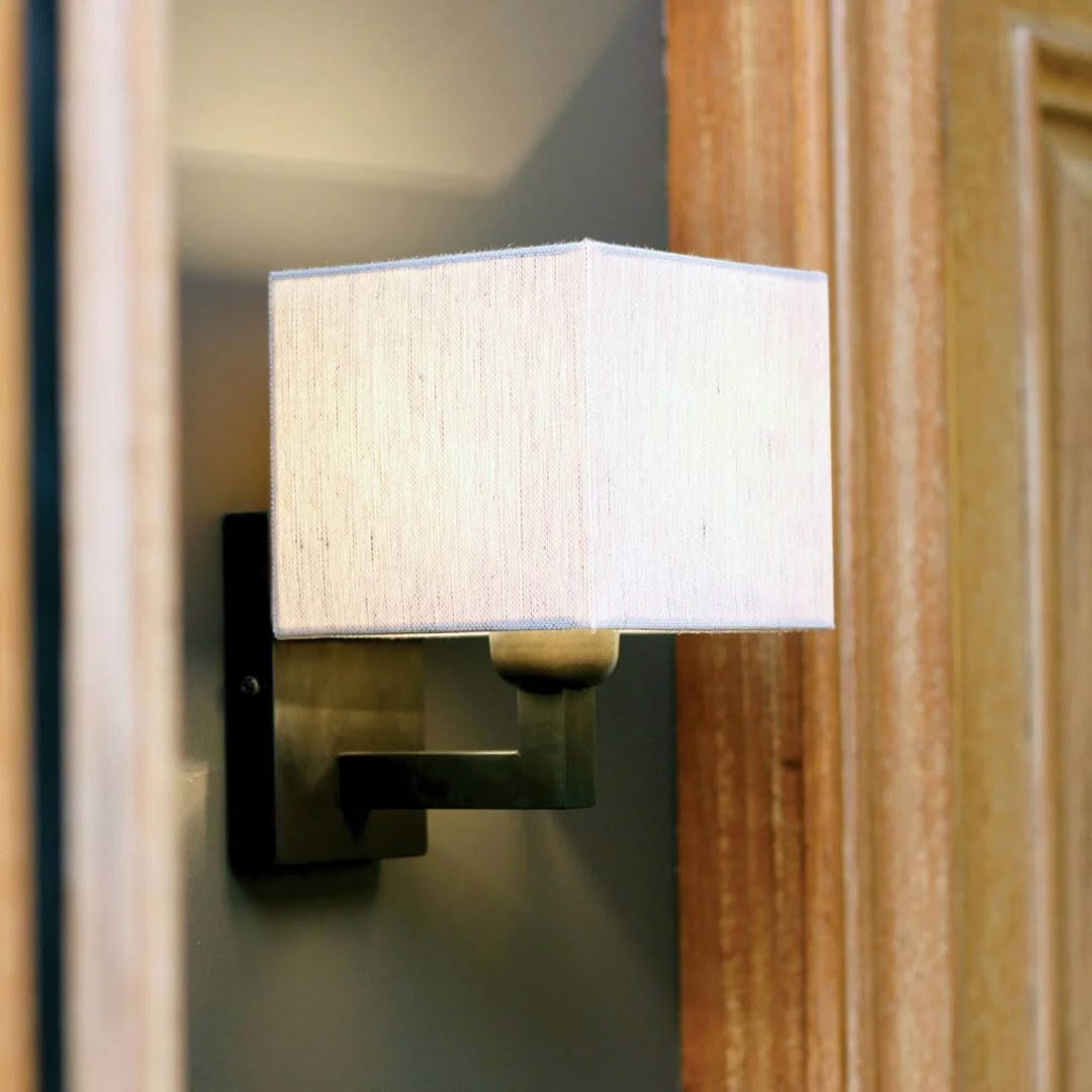 Modern square wall-mounted lamp by wooden door