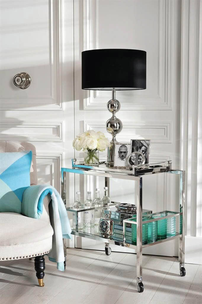 Elegant interior with modern bar cart and chic lamp