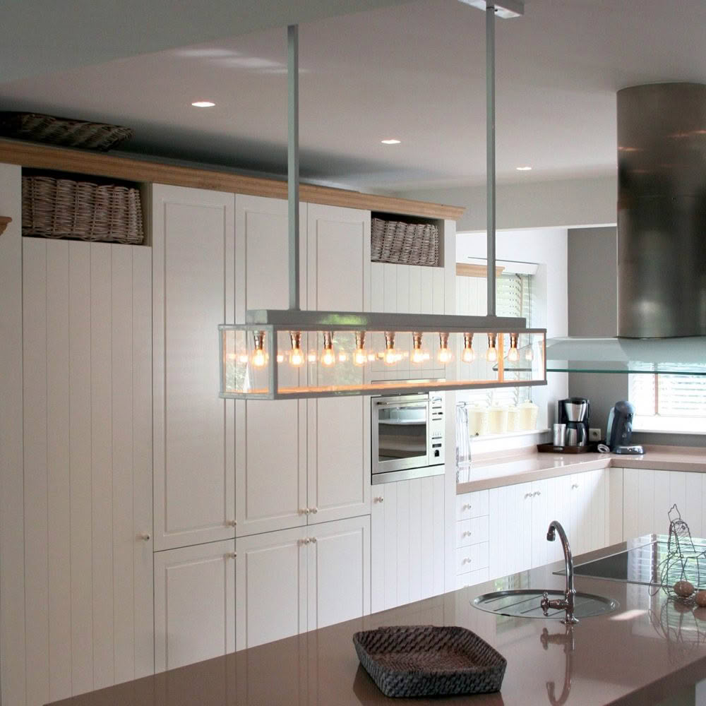 Modern kitchen with white cabinets and unique lighting