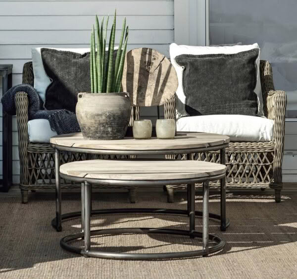 Cozy outdoor patio setup with wicker furniture and plants