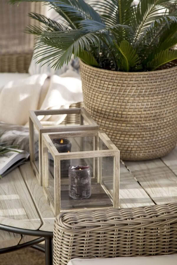 Outdoor patio design with wicker furniture and candles