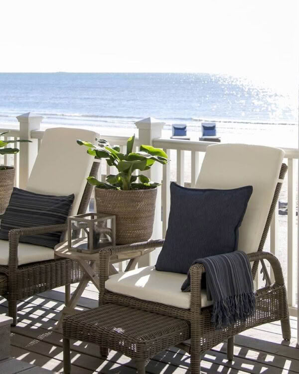 Beachfront balcony with chairs overlooking the ocean