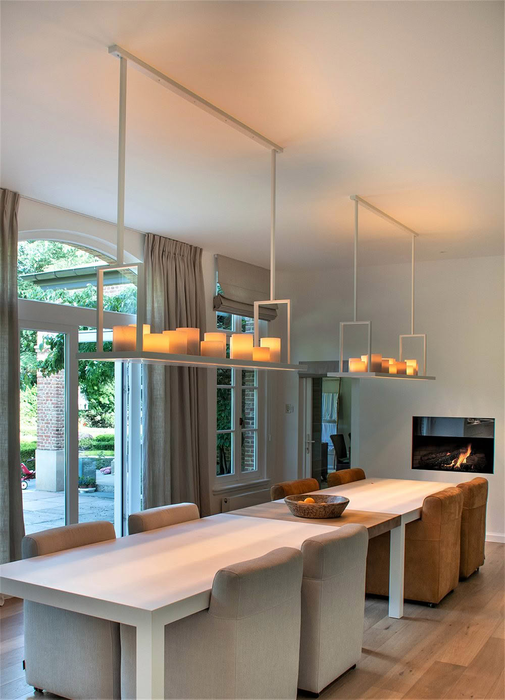 Modern dining room with unique suspended lighting