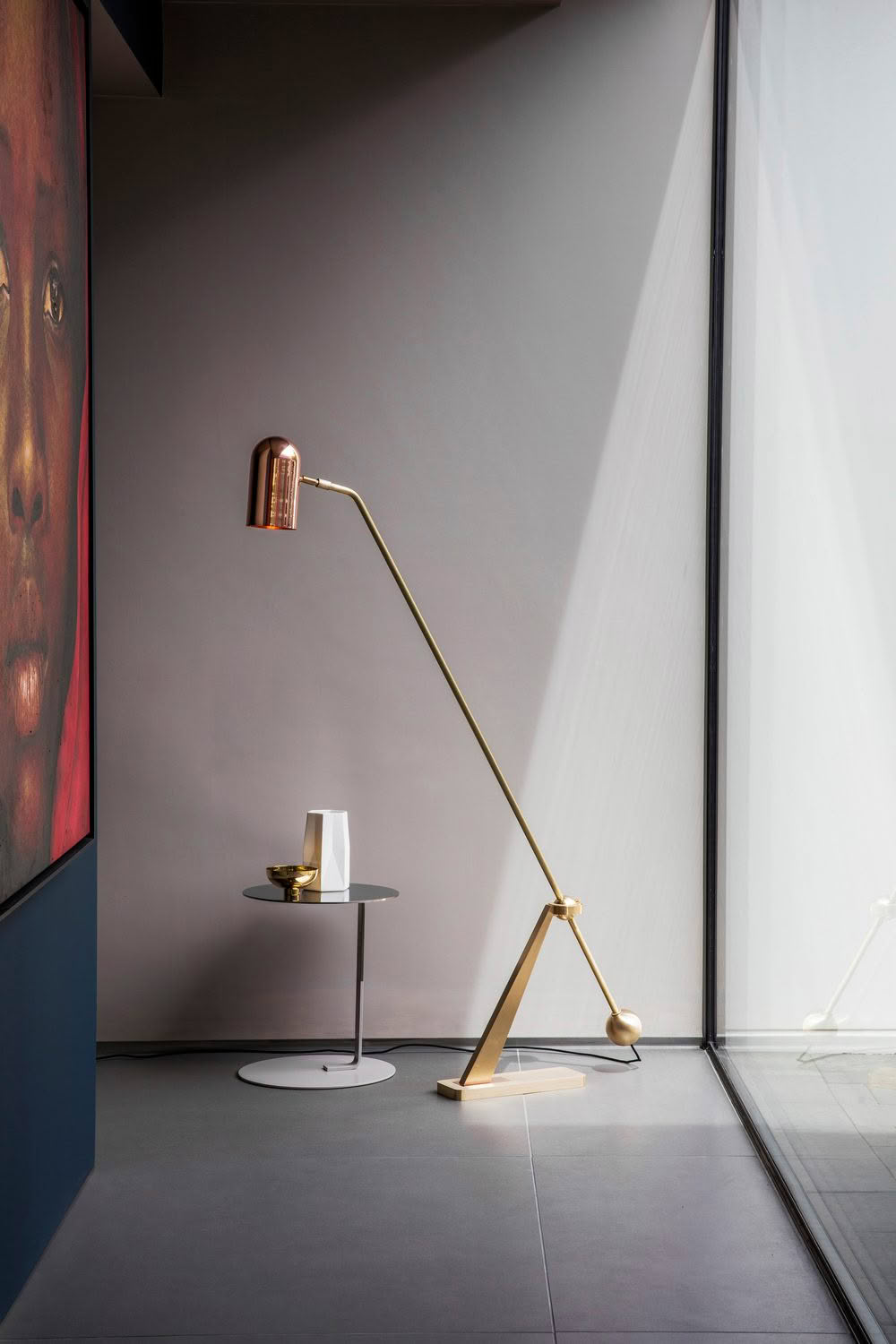 Elegant floor lamp beside artwork in modern interior