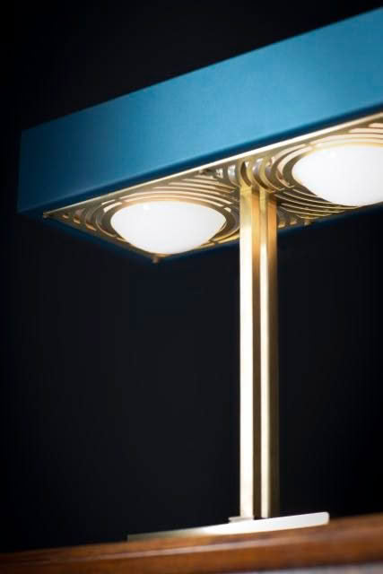 Modern desk lamp with decorative base and blue shade