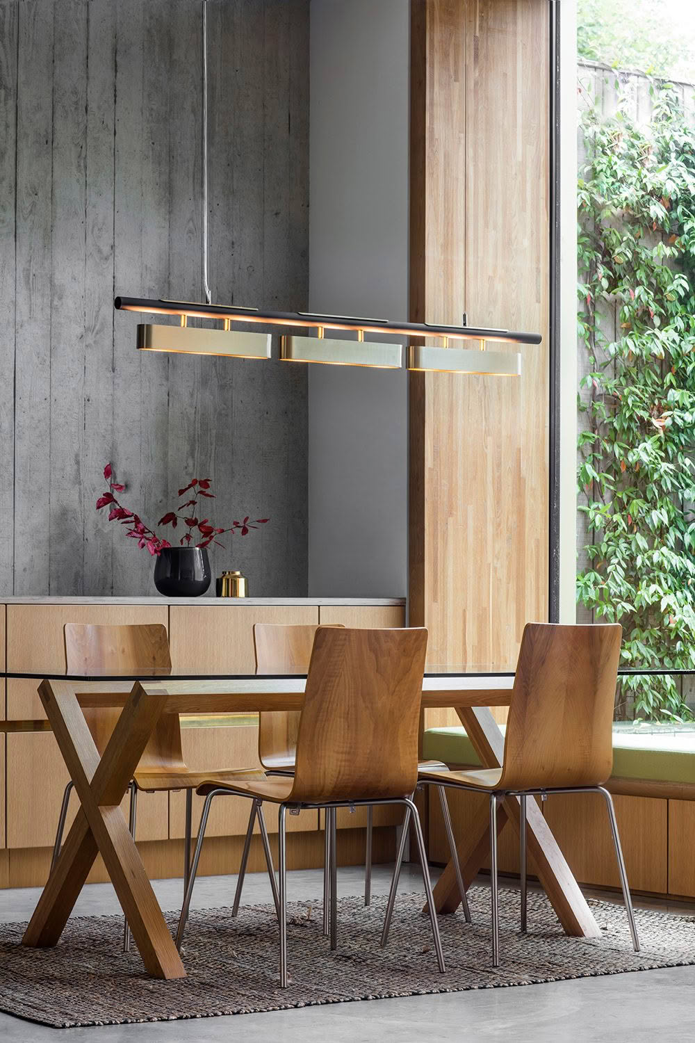 Modern dining room with wooden furniture and pendant light