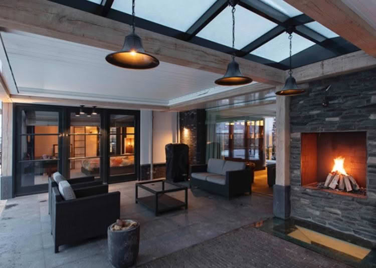 Modern patio with fireplace and stylish hanging lights