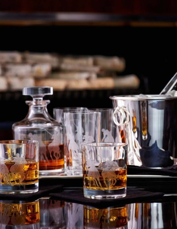 Elegant bar setup with whiskey glasses and decanter