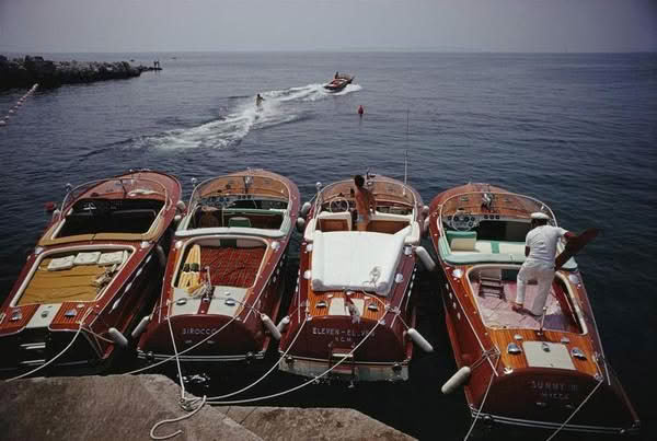 Vintage wooden boats docked at sea
