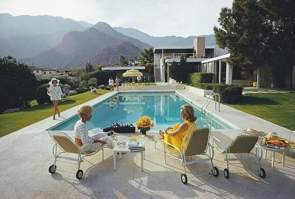 Vintage poolside gathering, luxury house, mountain backdrop