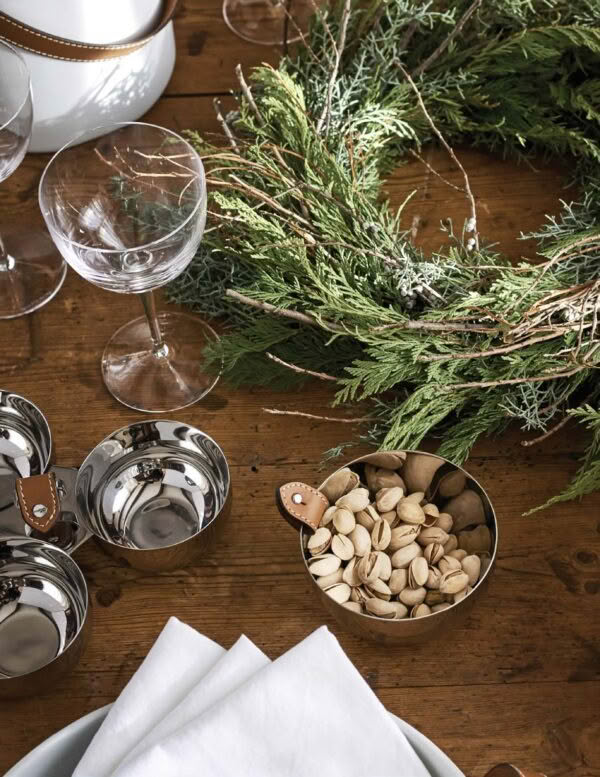 Rustic table setting with greenery and pistachios