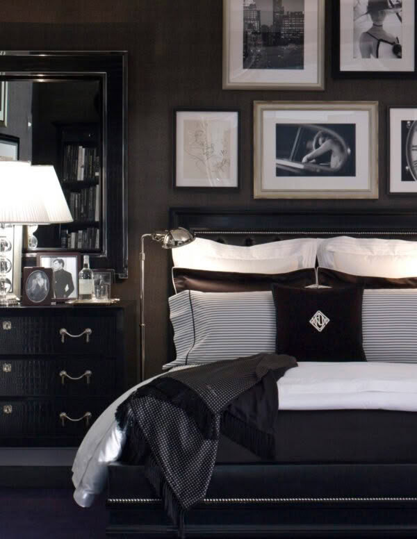 Elegant dark bedroom with framed art and striped bedding