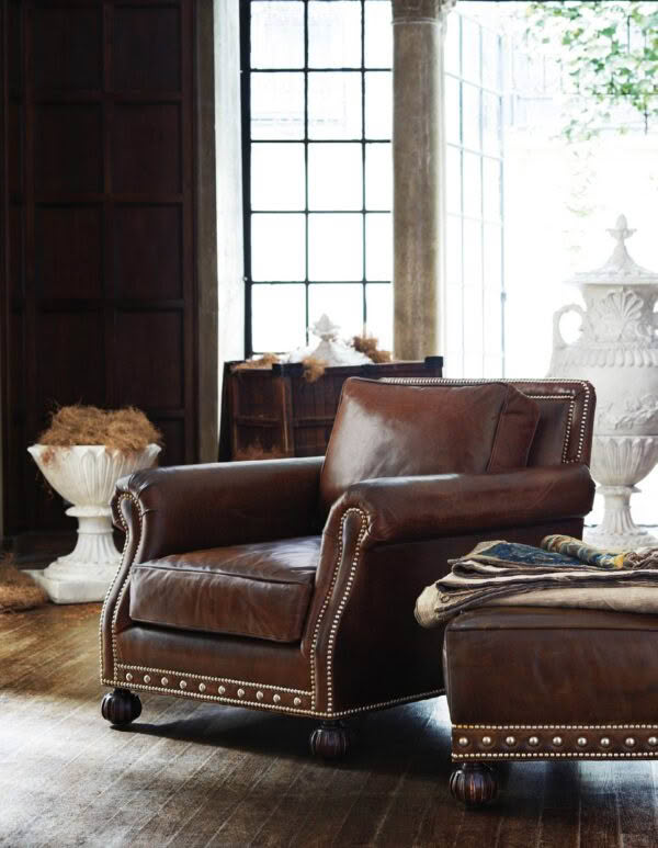 Vintage leather armchair in elegant, rustic interior