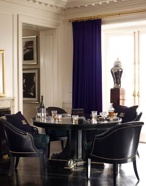 Elegant dining room with purple drapes and black table
