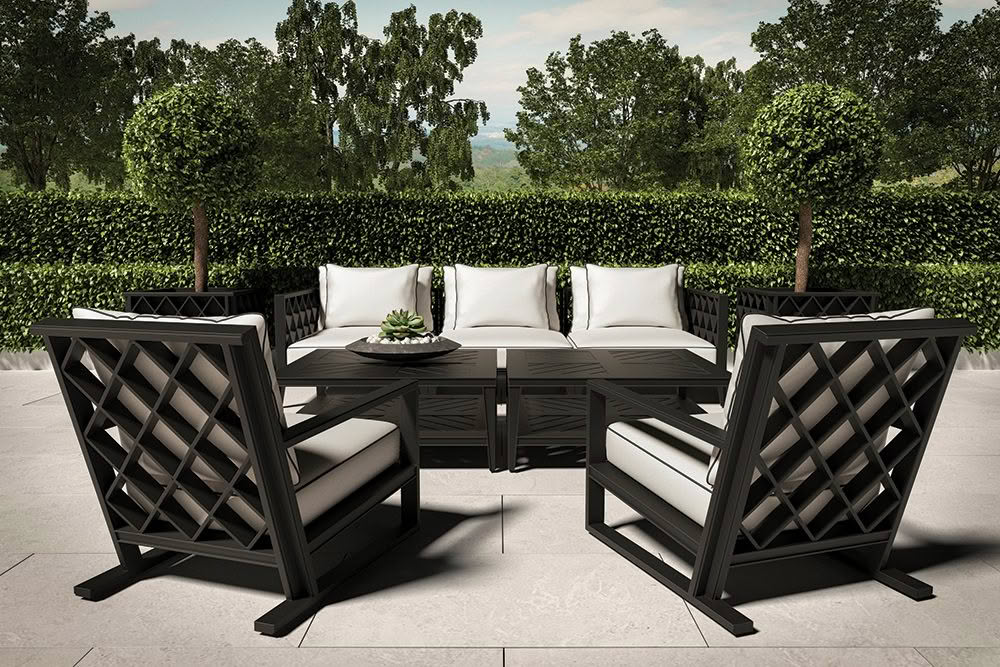 Elegant outdoor patio furniture set with lush green background