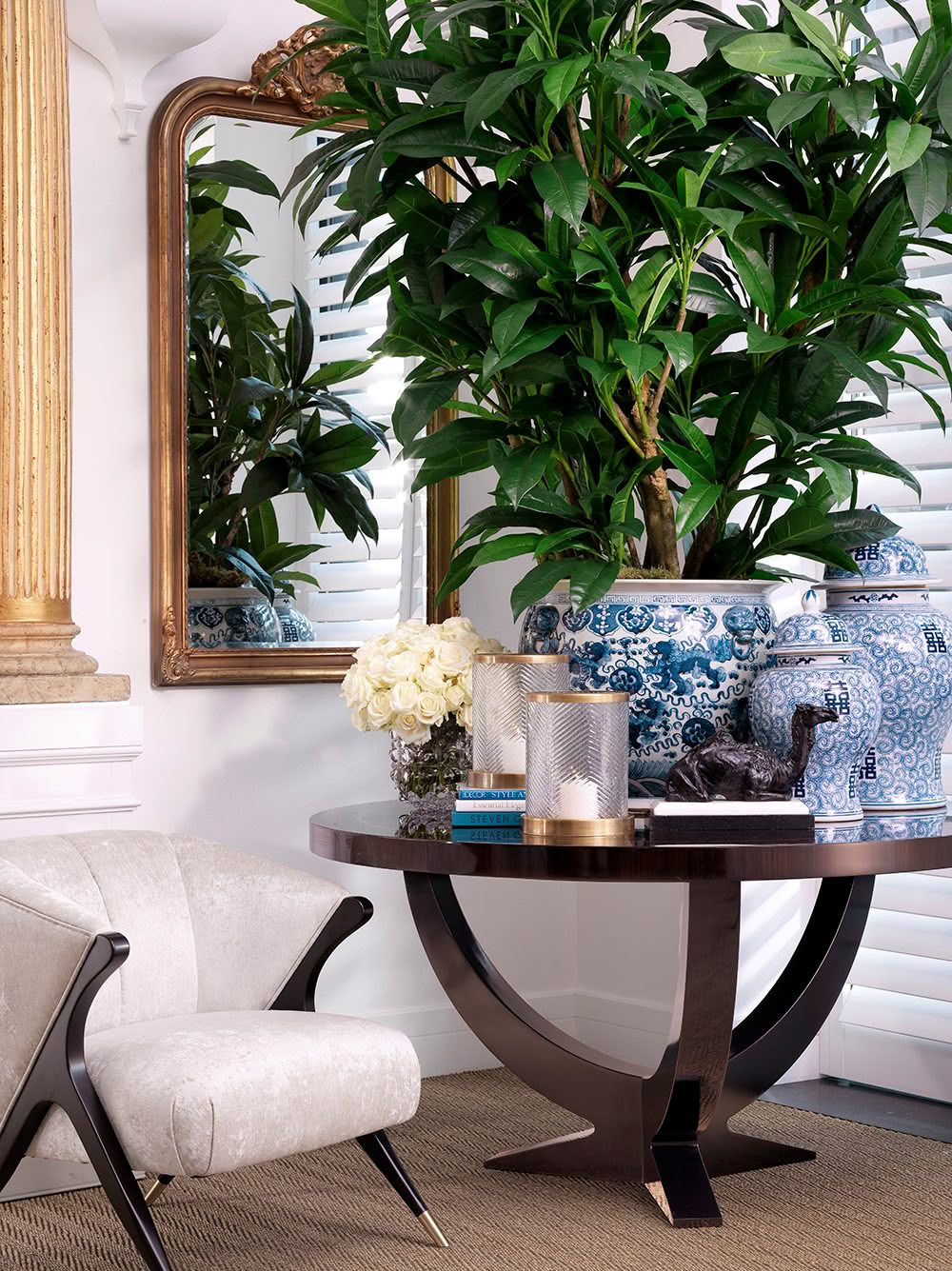 Elegant interior with mirror and lush green potted plant