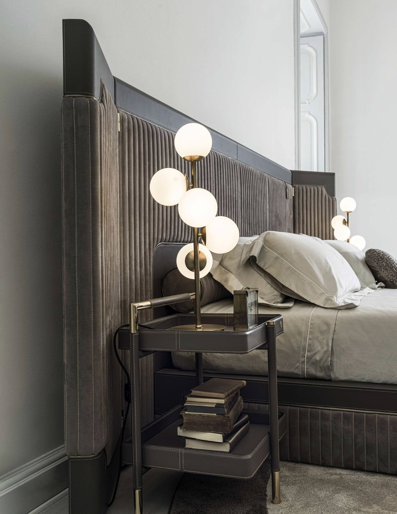 Elegant bedroom with stylish bed and modern lamp