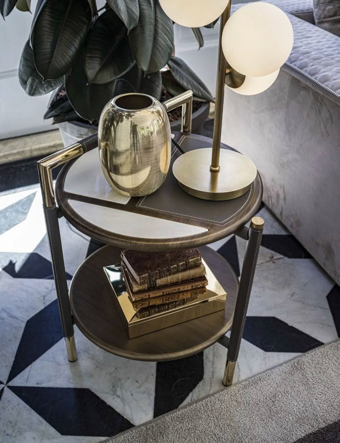 Elegant side table with lamp, books, and decorative vase
