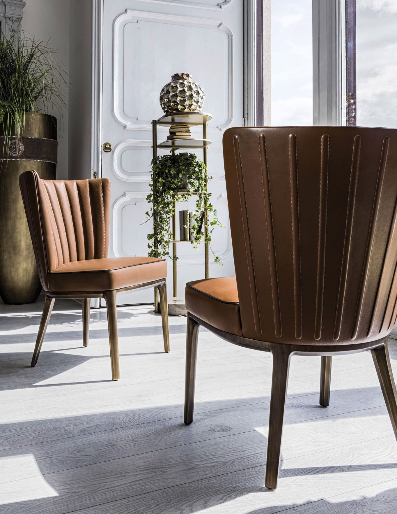 Elegant interior with leather chairs and decorative plants