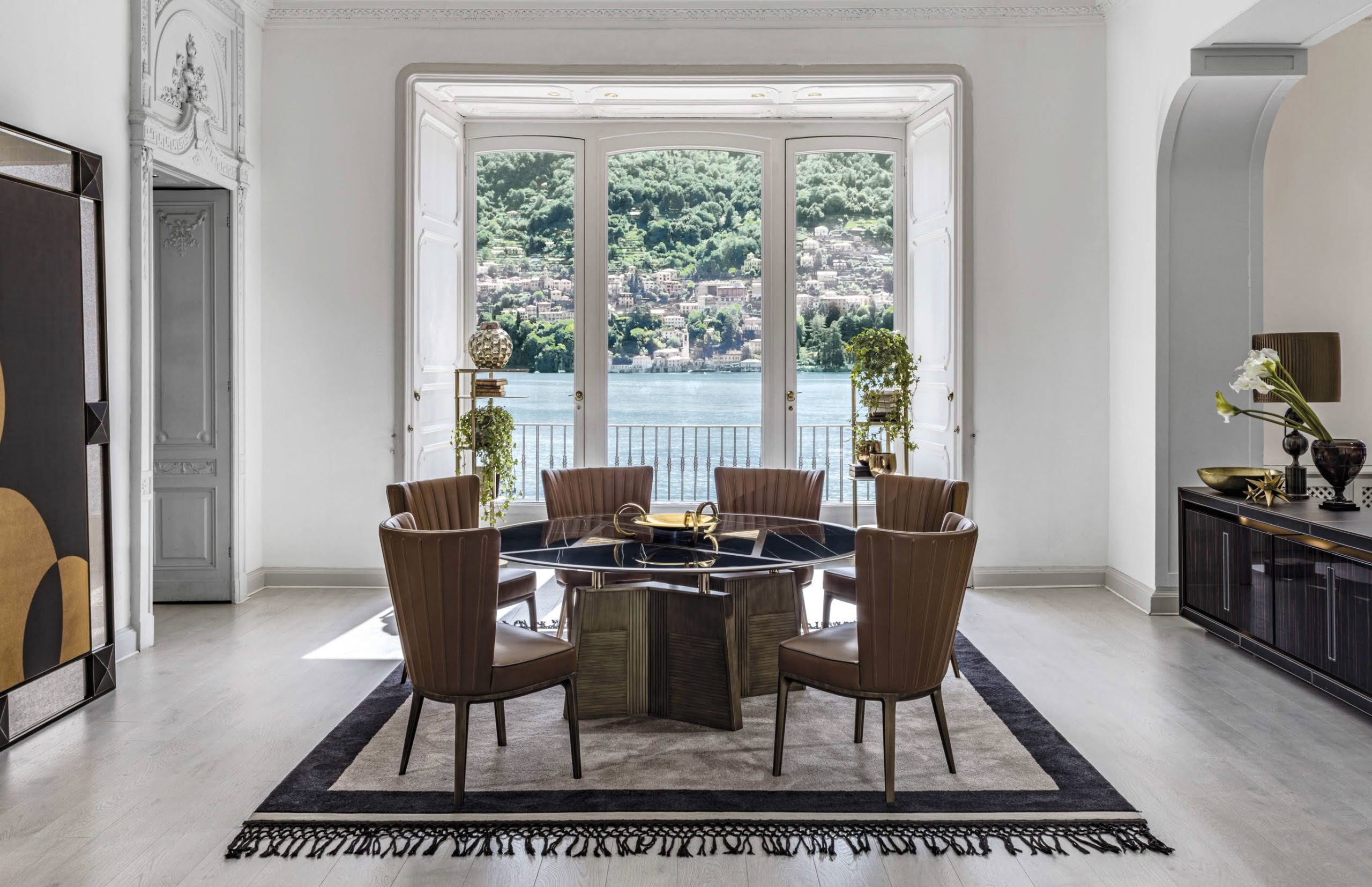 Elegant dining room with lake view through large windows