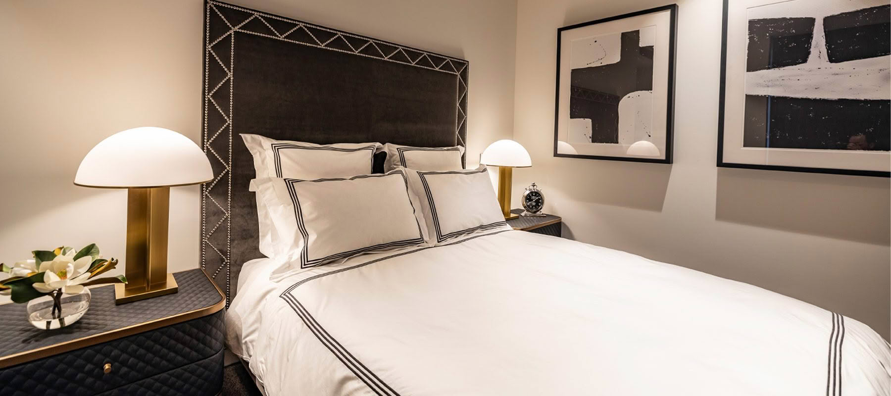 Elegant bedroom with stylish decor and modern lighting