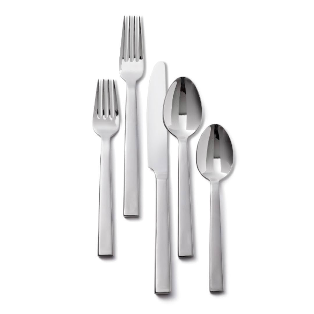 Assorted shiny stainless steel cutlery set on white