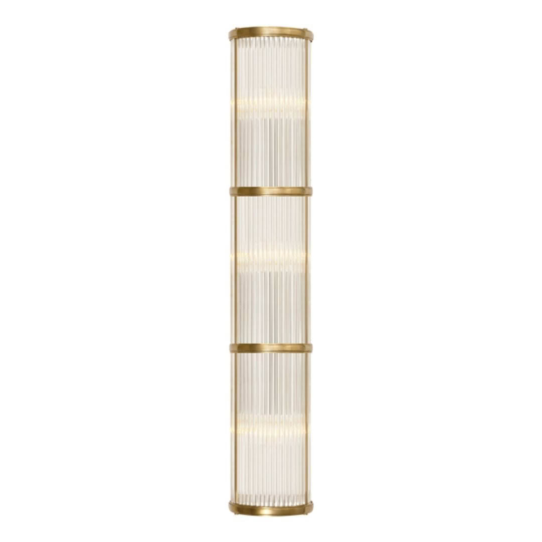 Tall gold floor lamp with vertical ribbed shade