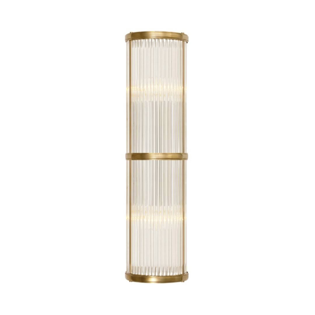 Tall gold floor lamp with vertical ribbed shade
