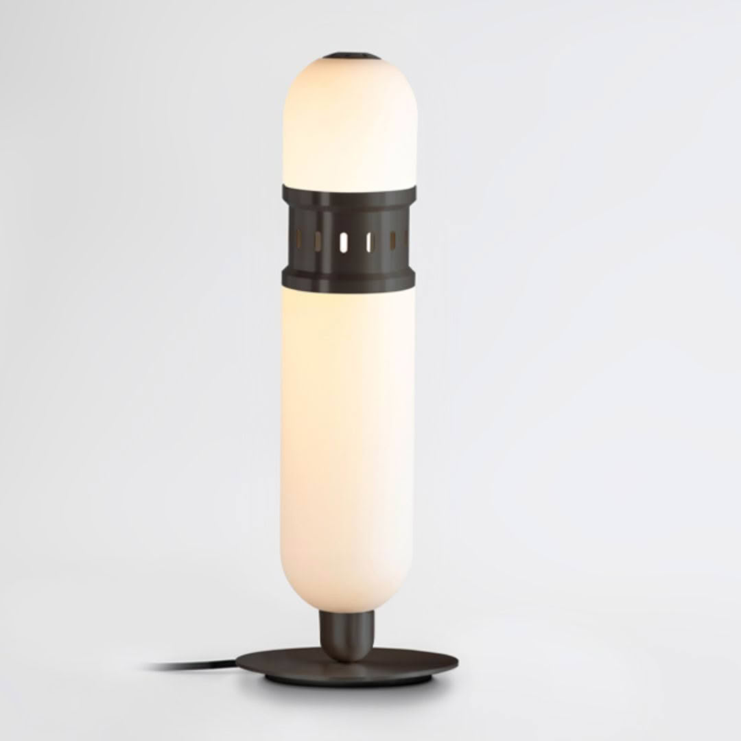 Modern black and white table lamp illuminated