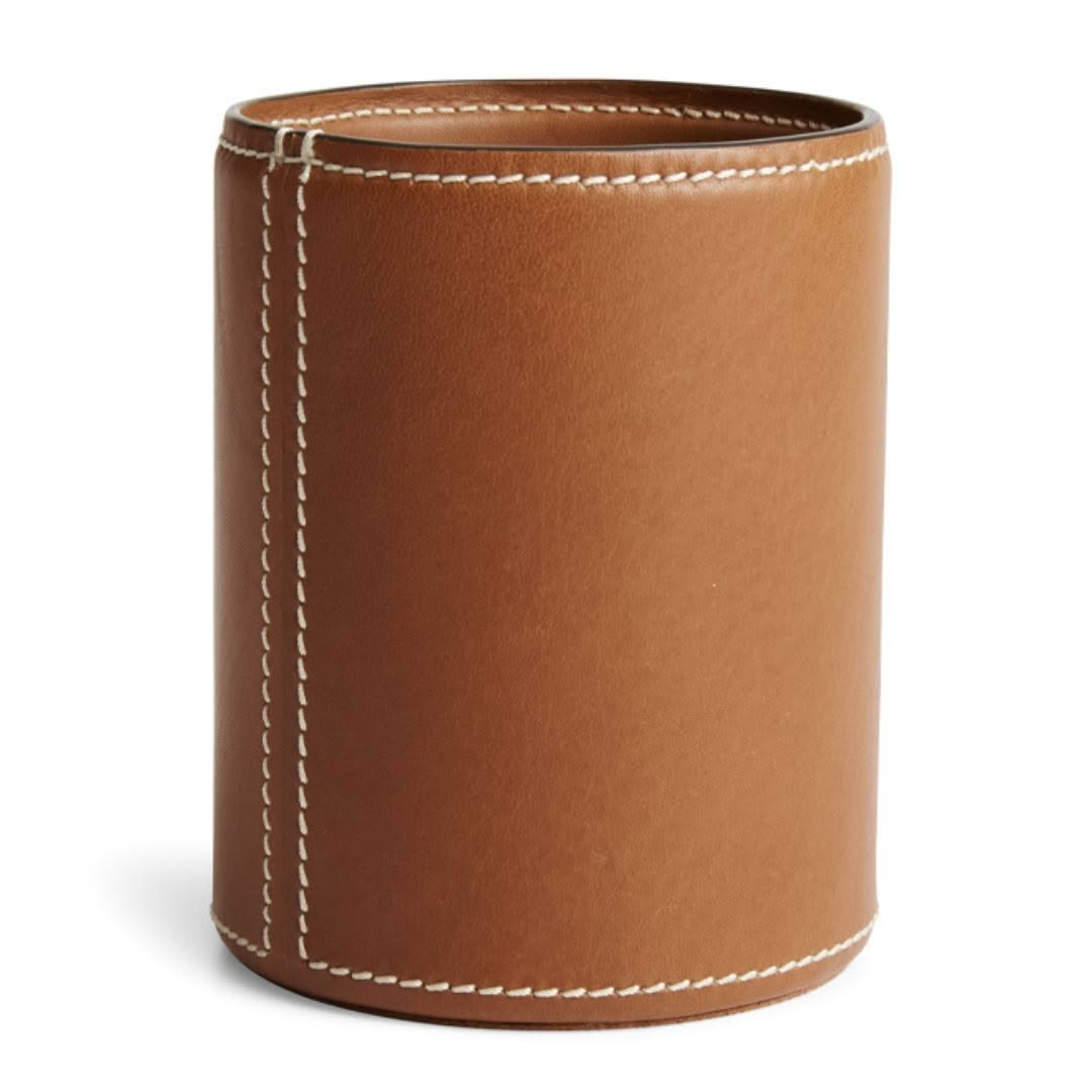 Brown leather cylindrical container with white stitching
