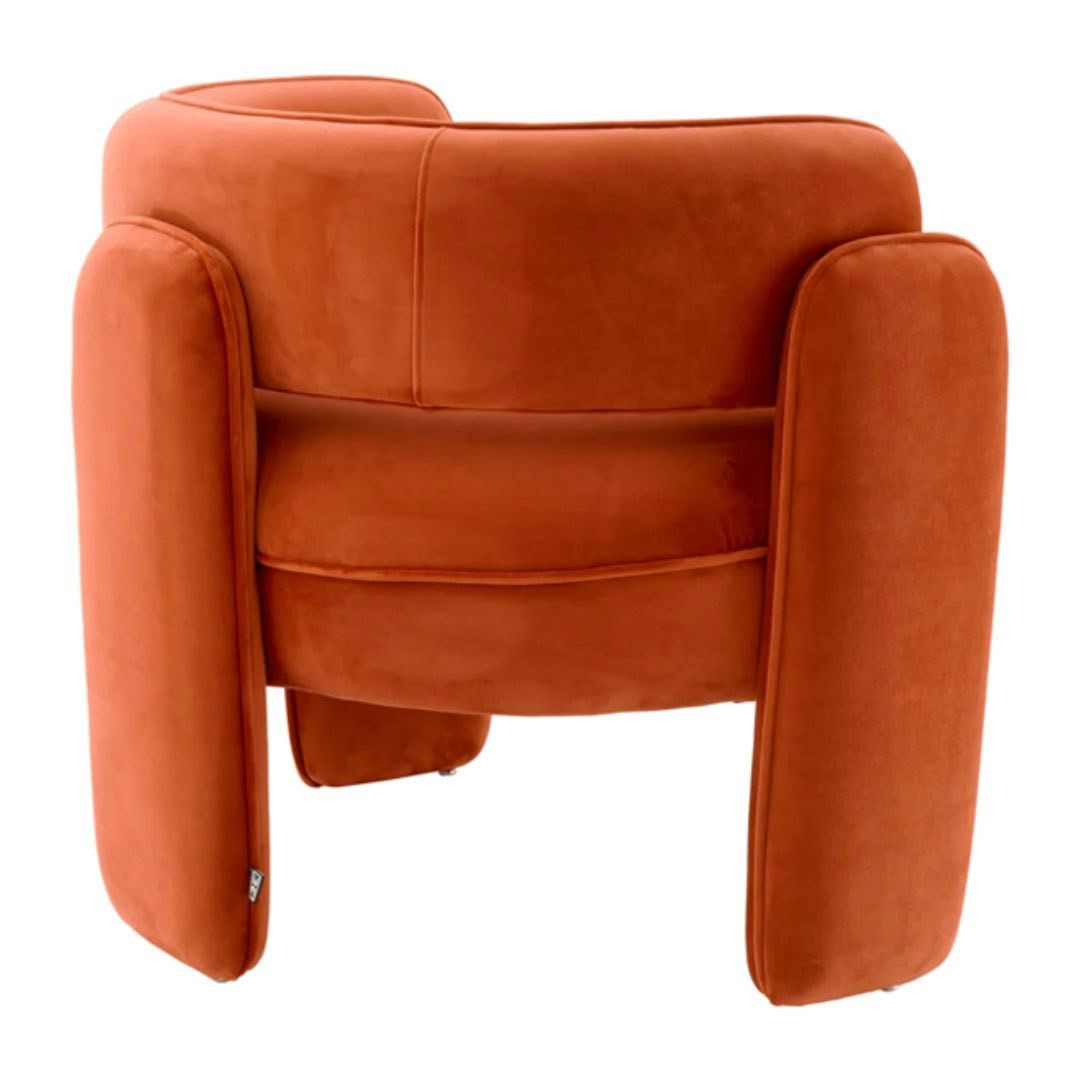 Orange velvet armchair with modern design isolated on white
