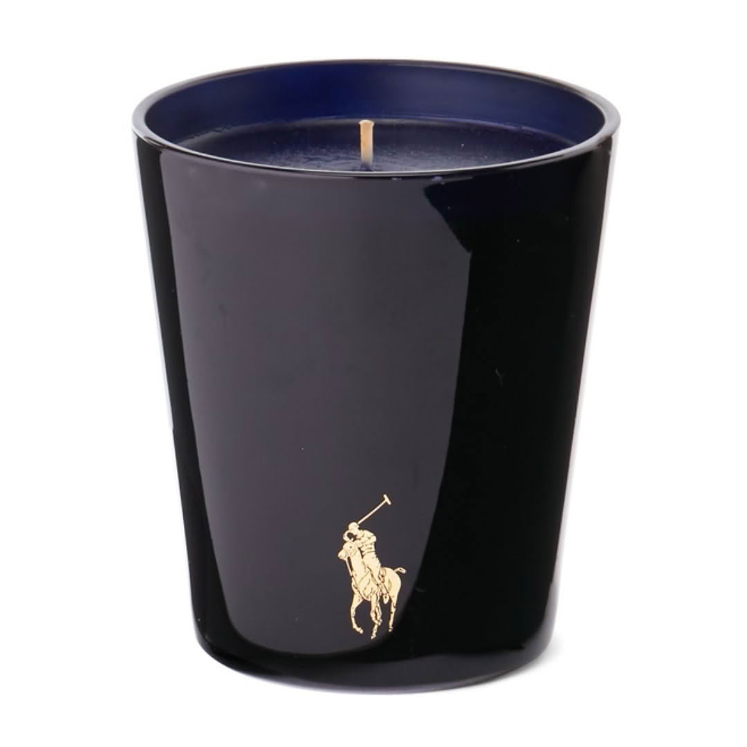 Black candle with gold polo player logo