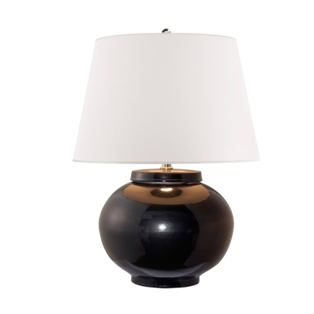 Black and gold spherical table lamp with white shade.