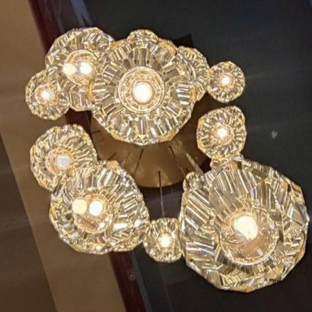 Golden crystal chandelier with multiple glowing lights
