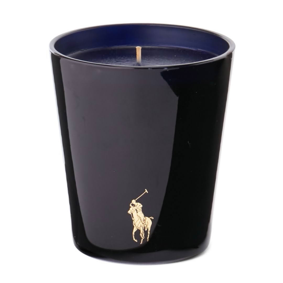 Black candle with gold polo player logo