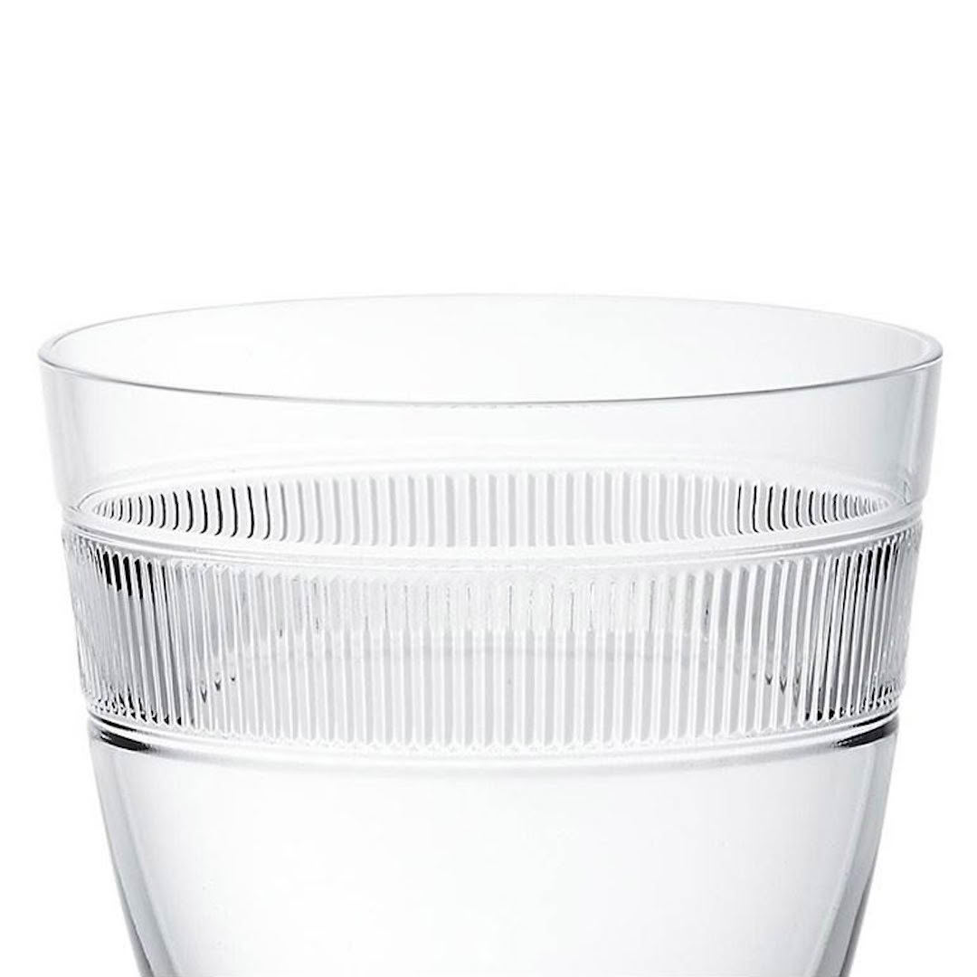 Clear ribbed glass half-filled with water
