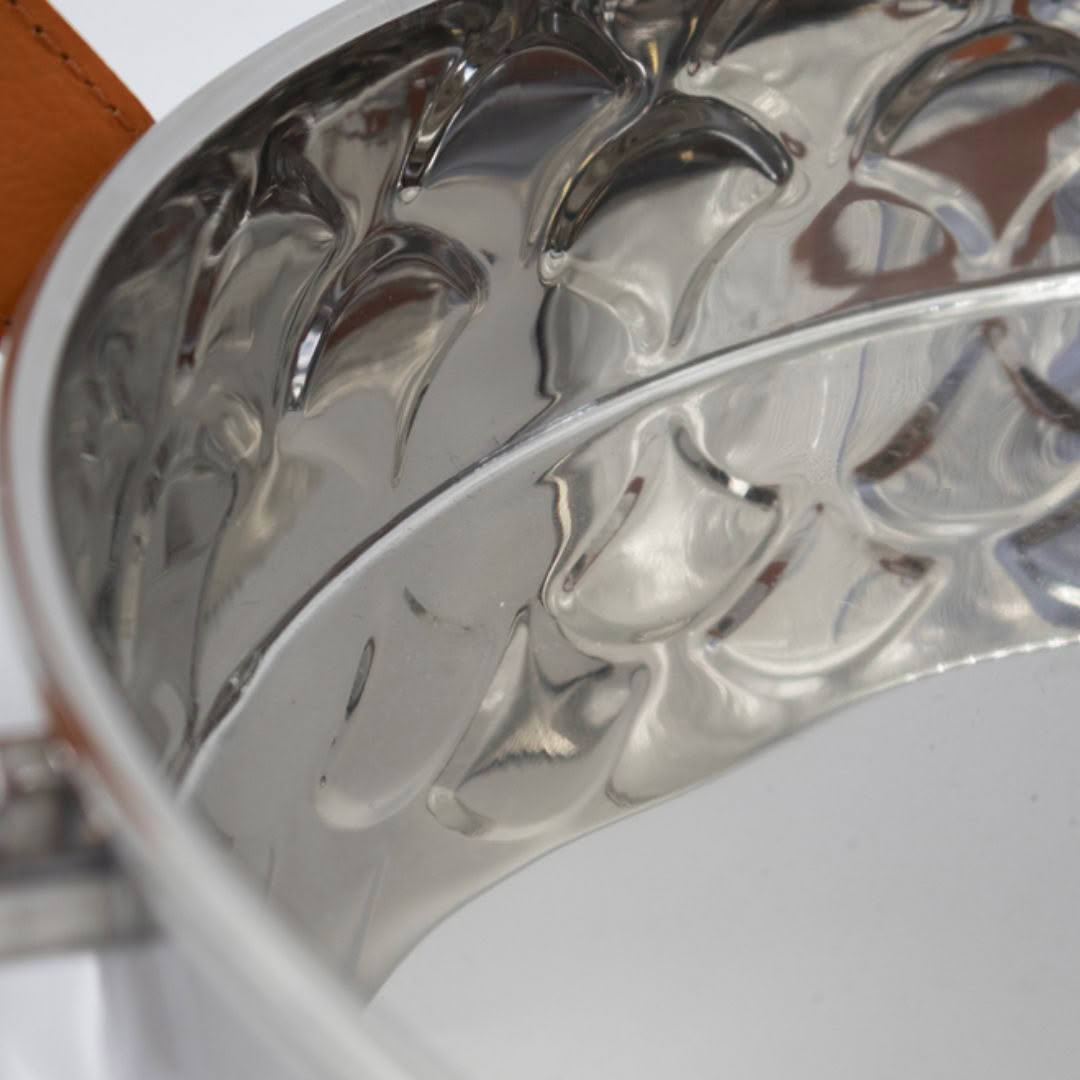 Close-up of reflective silver wavy surface