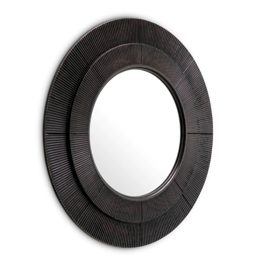Textured round black frame mirror on white background