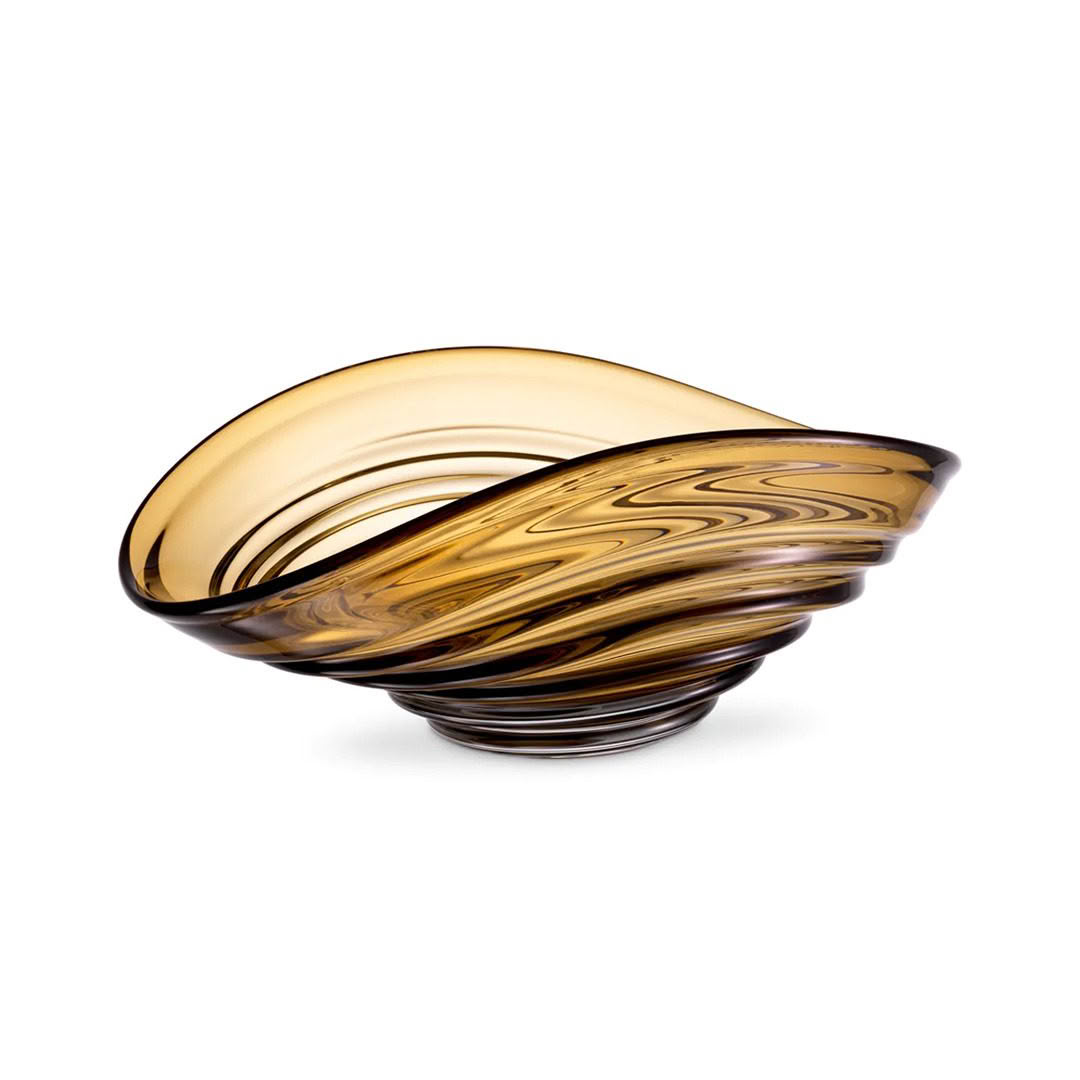 Swirled amber glass decorative bowl on white background