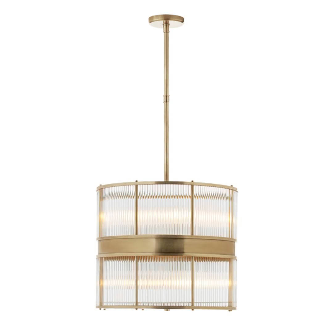 Elegant gold drum chandelier with ribbed glass panels