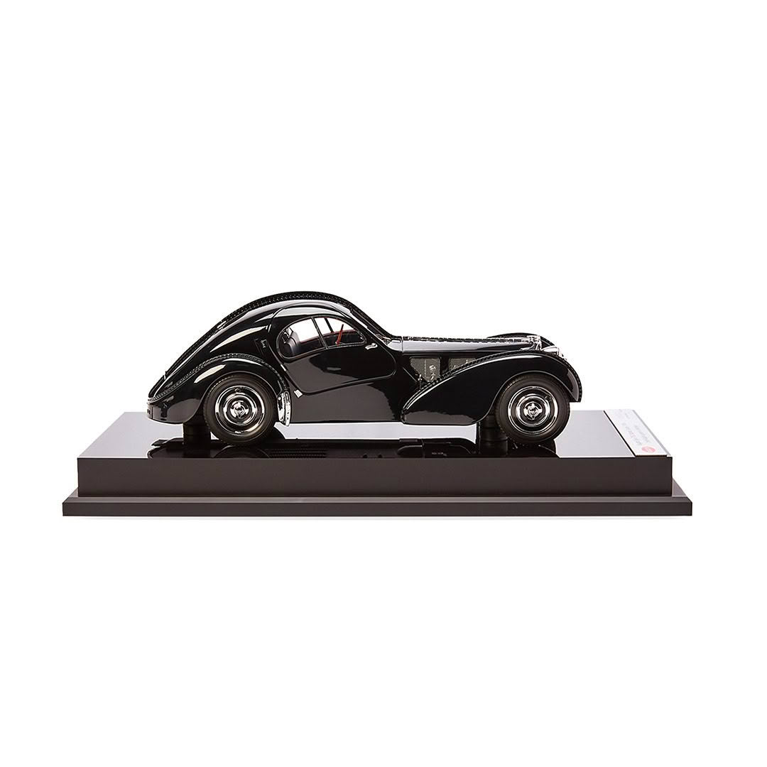 Black vintage car model on display stand